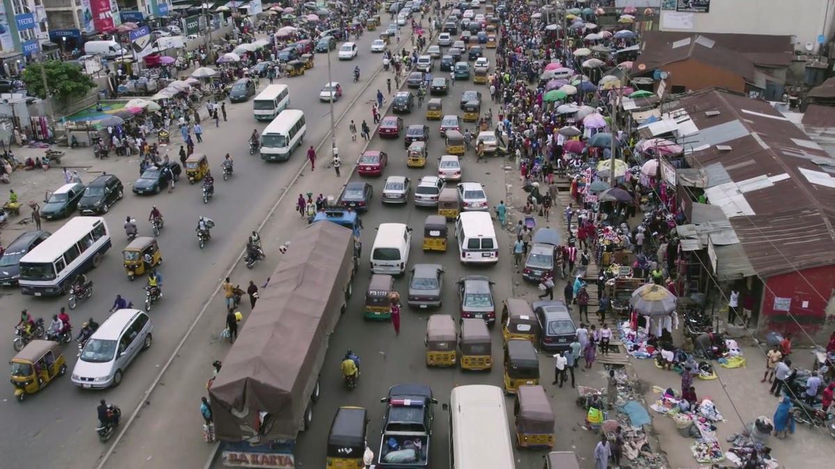 aerial view of african people high traffic street market and congestion