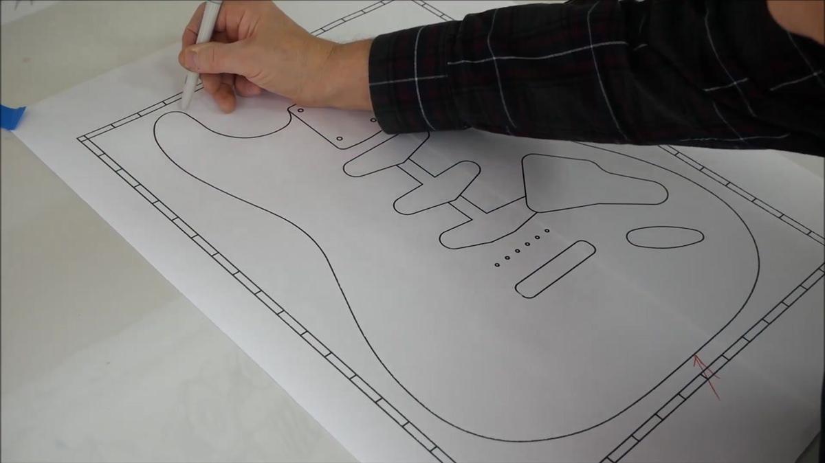 tracing an electric guitar diagram and cutting out the body from maple hard wood