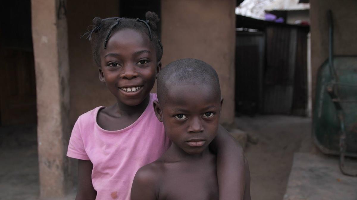 african village children posing and looking at the camera