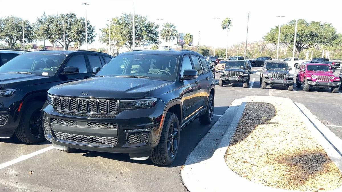 Nancy's Grand Cherokee lot video by Walter/ Airport CDJ 407-541-6200