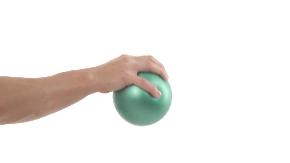 Close up picture of palms-down wrist curl training with hand exercise ball. Isolated on white background.