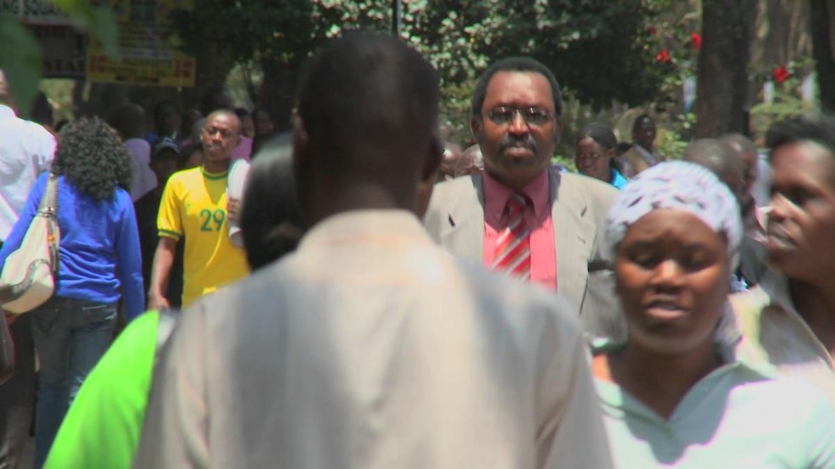 crowds of africans walk on the streets of nairobi kenya